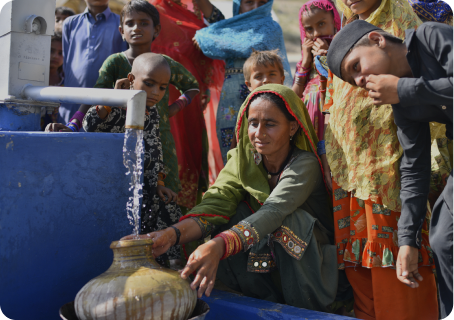 People handling rice bags and supplies